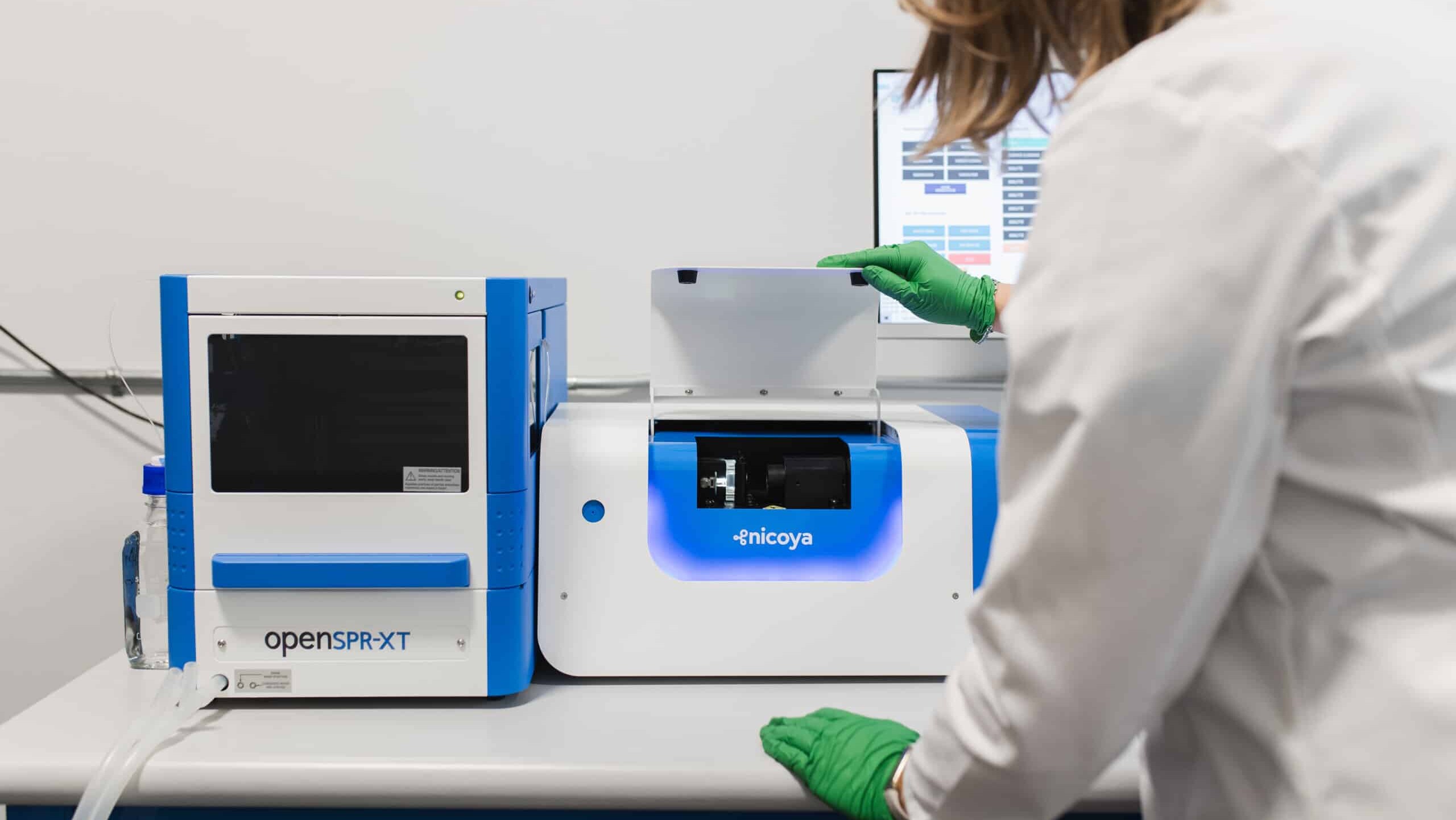 Lab technician using SPR equipment